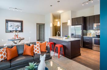 Living Area With Kitchen View at Mira Upper Rock, Rockville, MD, 20850