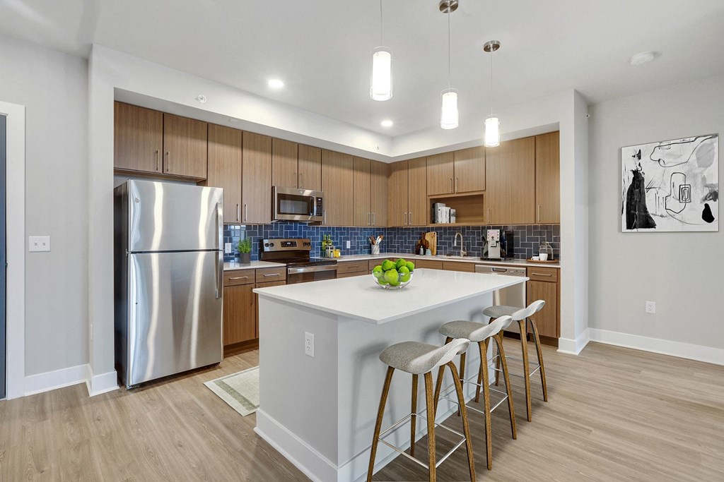 Fitted Kitchen With Island Dining at Woodmore Apartments, Maryland