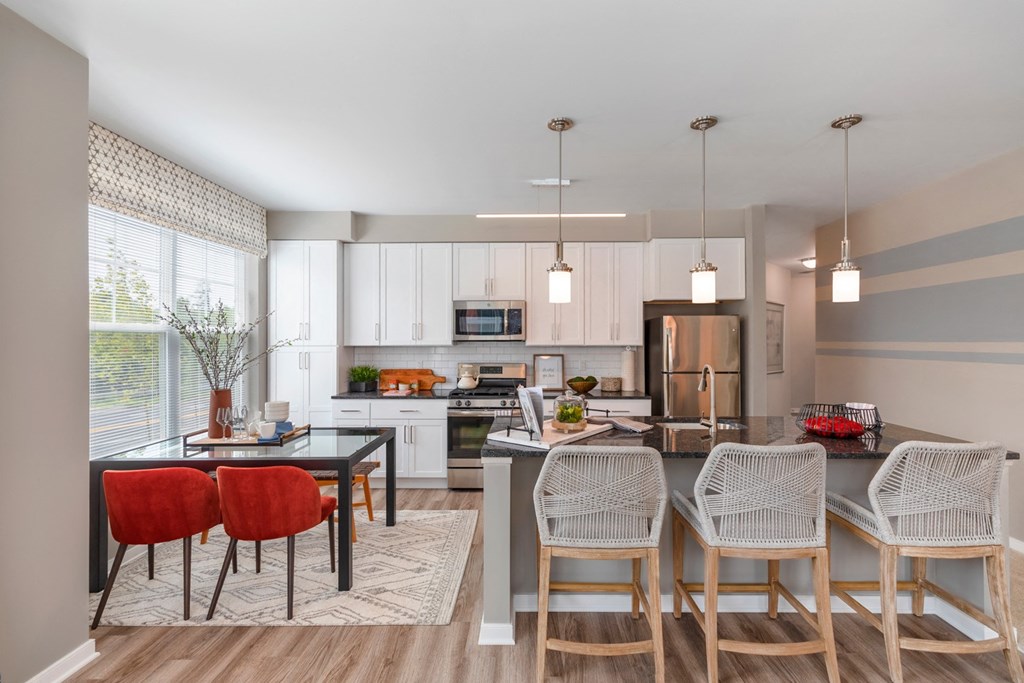 The Refinery kitchen and dining area in a 555 waverly unit