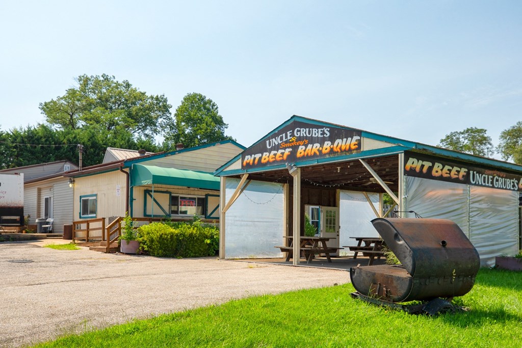 a building with a sign that reads pit beef barbecue