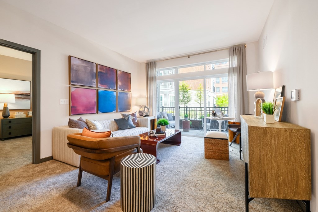 a living room with a large window and a couch