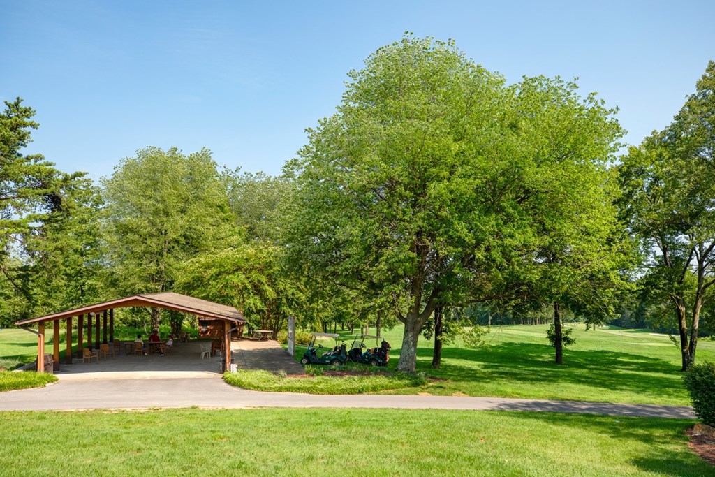 a pavilion in a park with trees