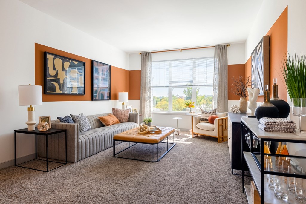 The Forge living room with a couch and a window