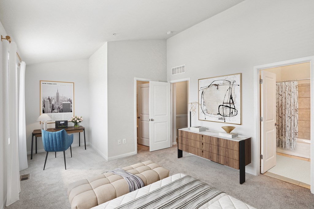 a bedroom with a bed and a desk and a mirror a bedroom with a bed and a desk and a mirror at Refinery Row, Baltimore, MD 21224