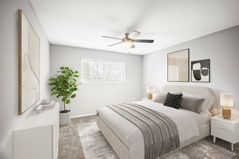 a bedroom with a bed and a ceiling fan a bedroom with a bed and a ceiling fan at Villages at Morgan Metro, Landover, Maryland
