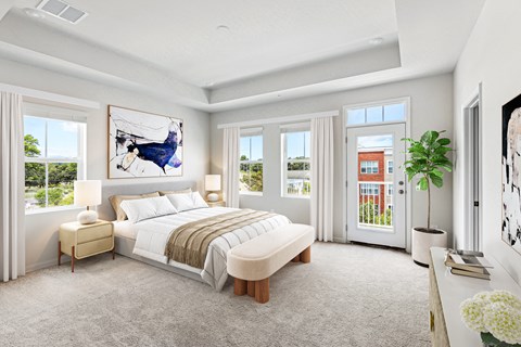a bedroom with a bed and a large window