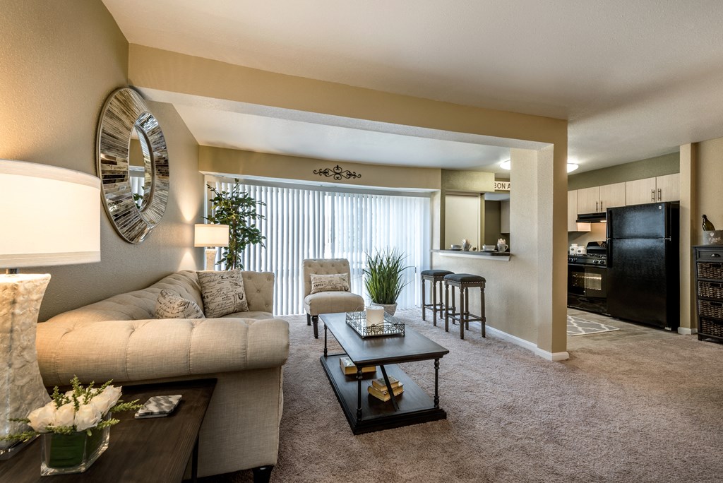 Decorated Living Room With Natural Light with a couch and a coffee table at Meadows at Capitol Heights, Capitol Heights, MD, 20743