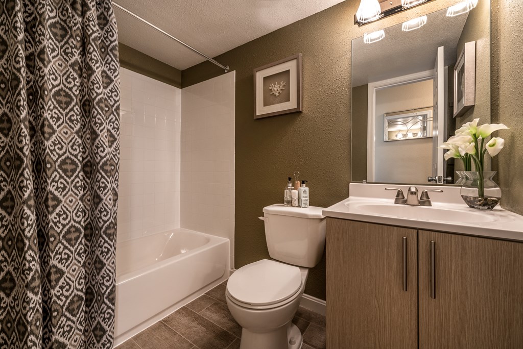 Bathroom with a toilet, sink and a tub at Meadows at Capitol Heights, Maryland, 20743