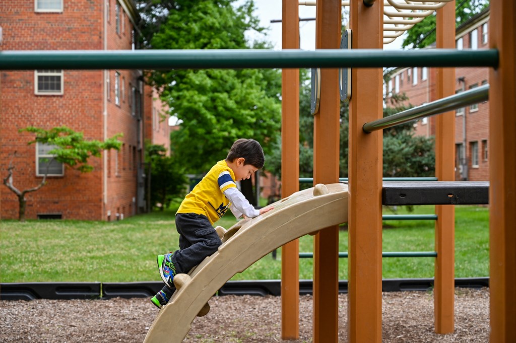 boy on playground at Hamilton Manor Apartments, Maryland, 20782
