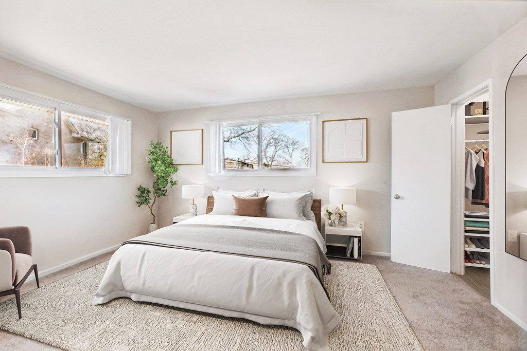a bedroom with a bed and a closet at Laurel Pines, Laurel, Maryland