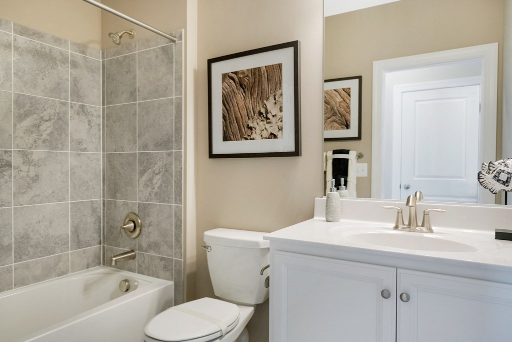 a bathroom with a sink toilet and tub and a shower