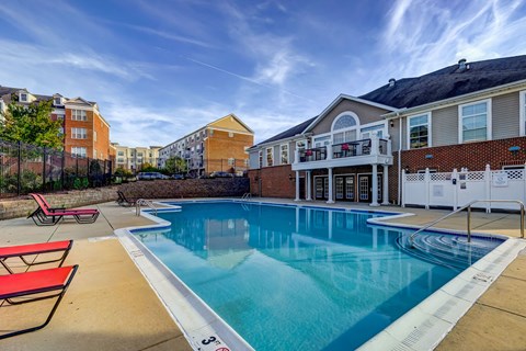 our apartments have a large pool with a blue sky above it at MetroPlace at Town Center, Maryland, 20746