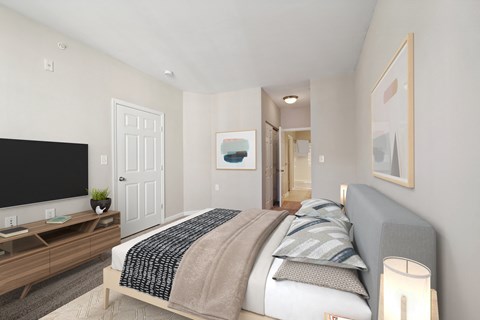 a bedroom with a large bed and a tv