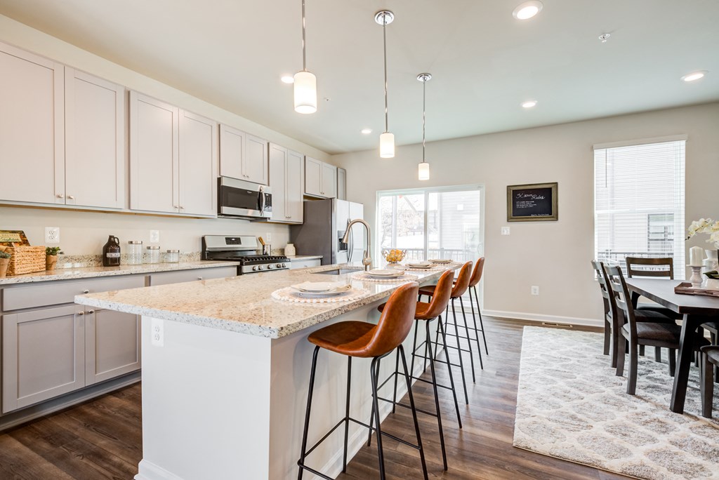 Kitchen with Island and Bar Stools at Refinery Row, Maryland