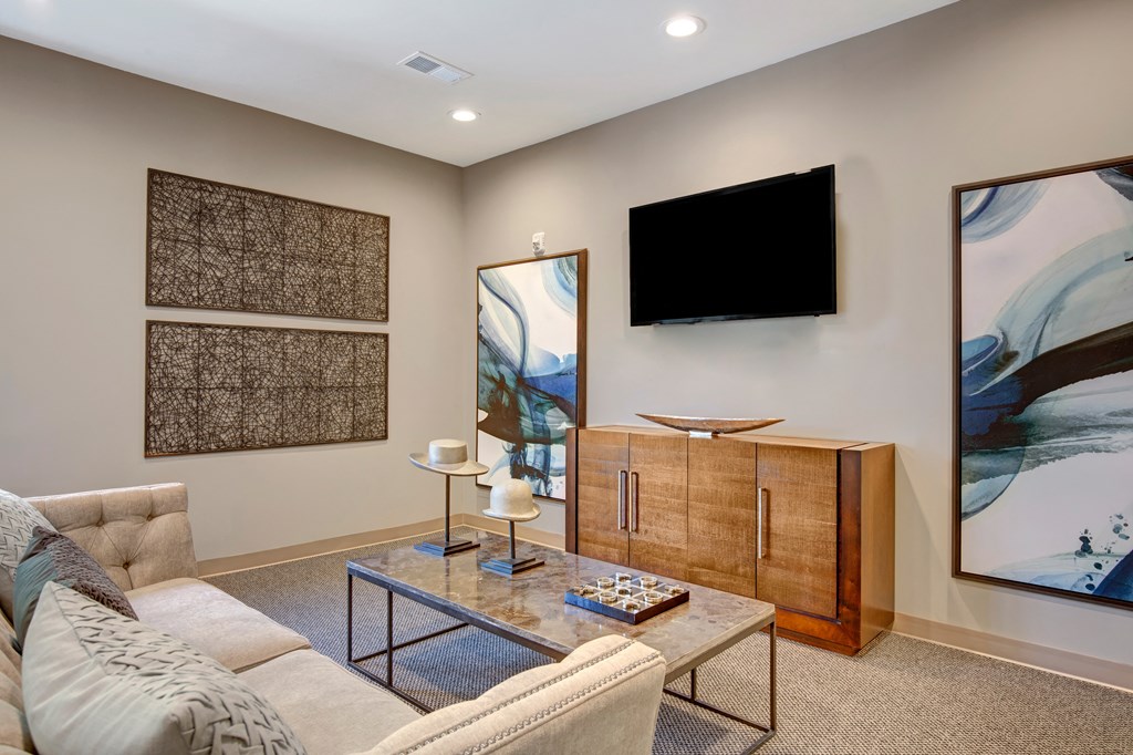 a living room with a couch and a television at Villages at Morgan Metro, Landover