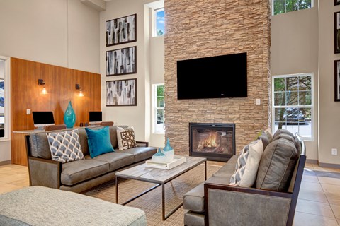 a living room with a fireplace and couches at Villages at Morgan Metro, Maryland, 20785