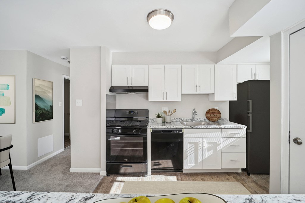 a kitchen with black appliances and white cabinetry at Capitol Heights, Capitol Heights, MD, 20743