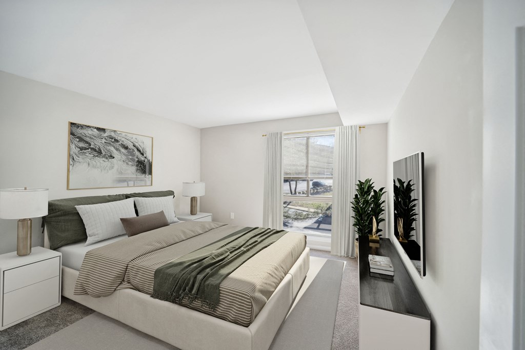 a bedroom with a bed and a large window at Capitol Heights, Capitol Heights, MD
