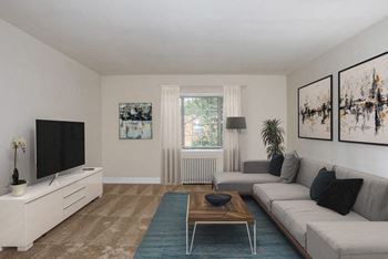 A living room with a couch and a coffee table at Hamilton Manor Apartments, Hyattsville, Maryland