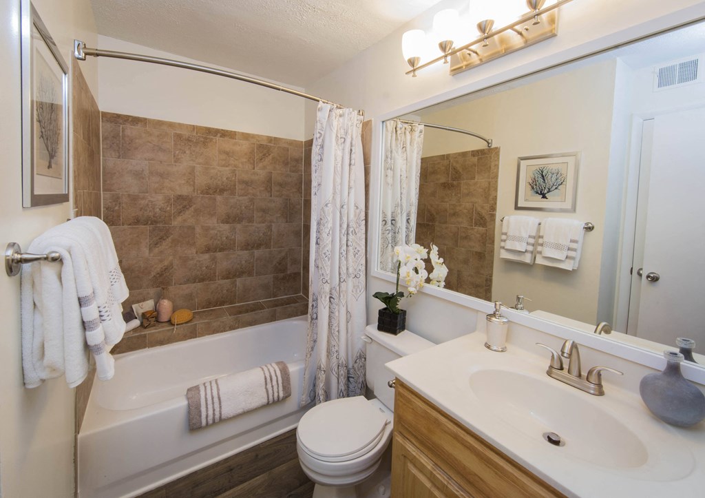 a bathroom with a sink toilet and bathtub at Madison at Eden Brook, Columbia, 21046