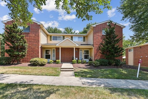 a brick house with a sidewalk in front of it at Villages at Morgan Metro, Landover, Maryland, 20785