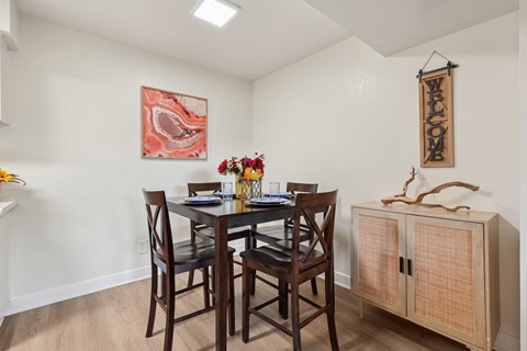 A dining room with a wooden table and chairs at Riviera Park, Chandler Arizona