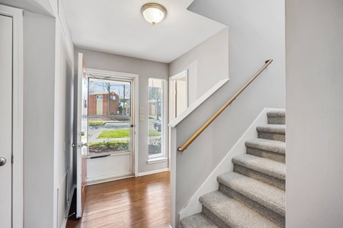 the entryway of a house with stairs and a door to a yard at Villages at Morgan Metro, Maryland, 20785