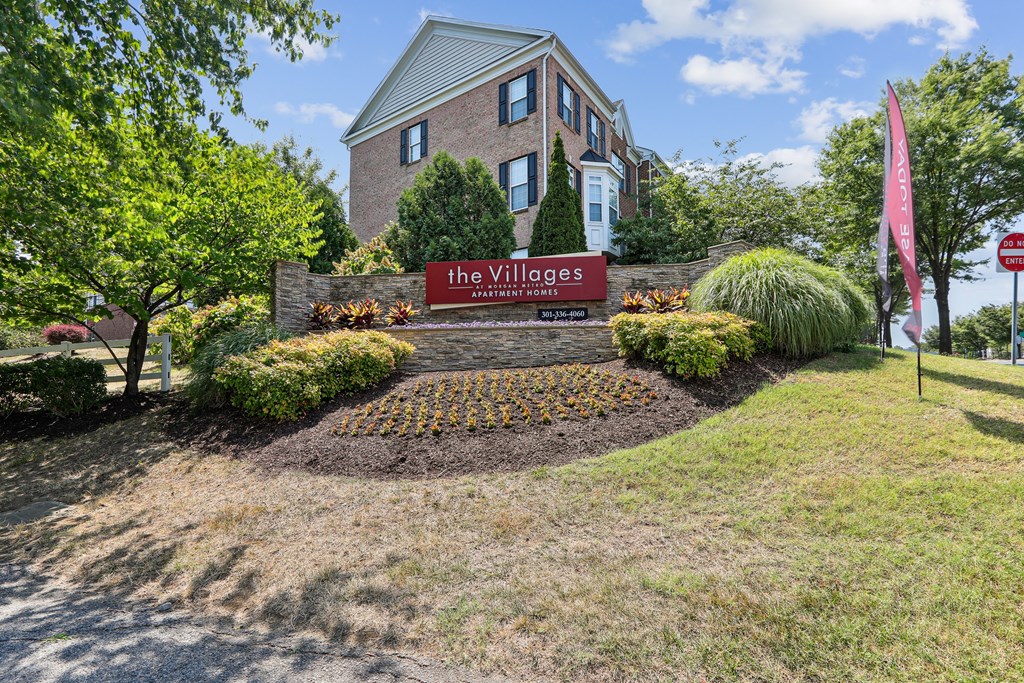 the village sign in front of a brick house at Villages at Morgan Metro, Landover, Maryland
