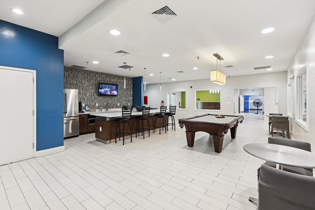 a clubhouse with a pool table and a bar and a tv at Villages at Morgan Metro, Landover, MD, 20785