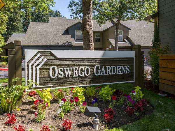 a sign in front of a house