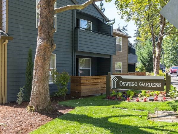 a house with a sign for oyster gardens