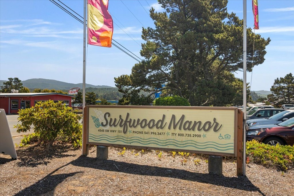 Surfwood Manor sign with Surfwood Manor written on it.