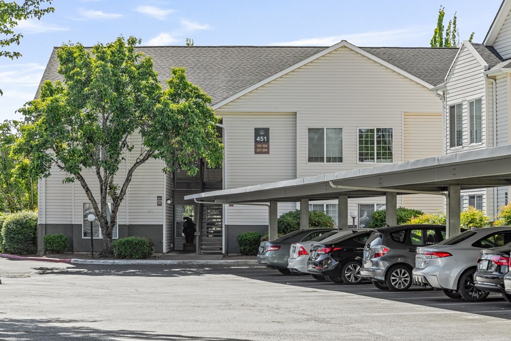 A building with a parking lot in front of it.
