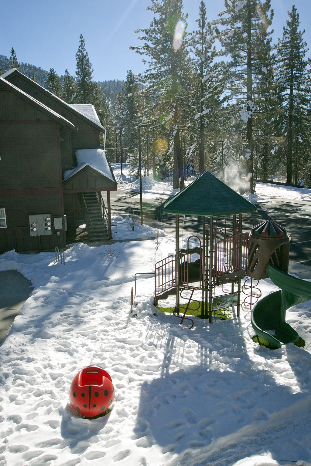 Aspens at South Lake play structure in the snow