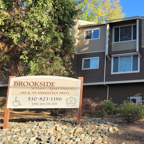 a building with a foreclosure sign in front of it