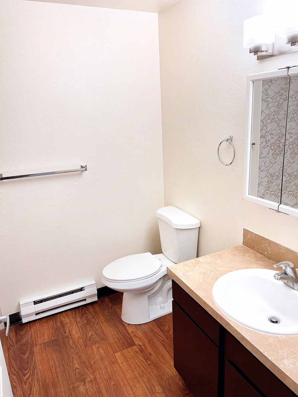 an empty bathroom with a toilet and a sink