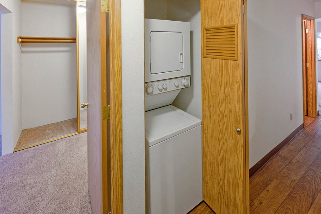 a small laundry room with a washer and dryer