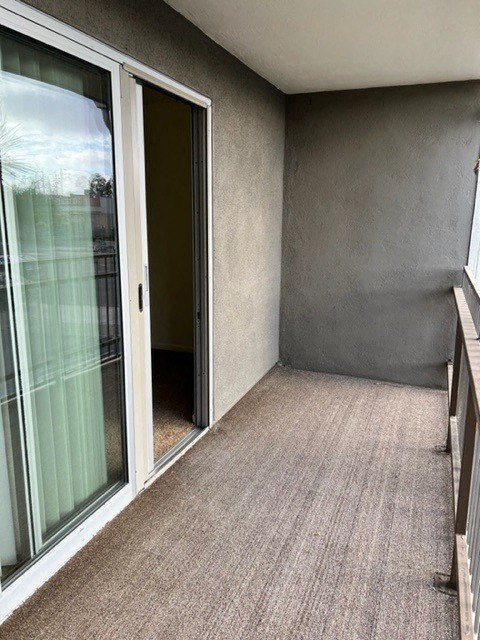 an empty room with a sliding glass door