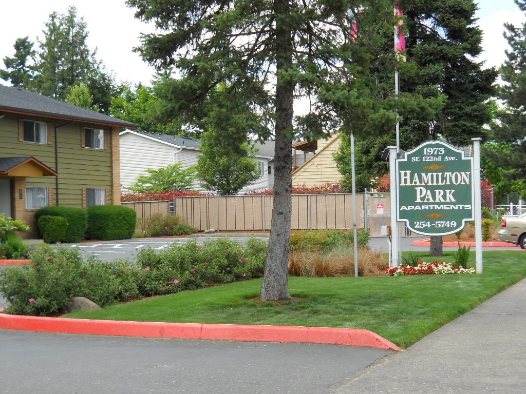 a sign in front of a house