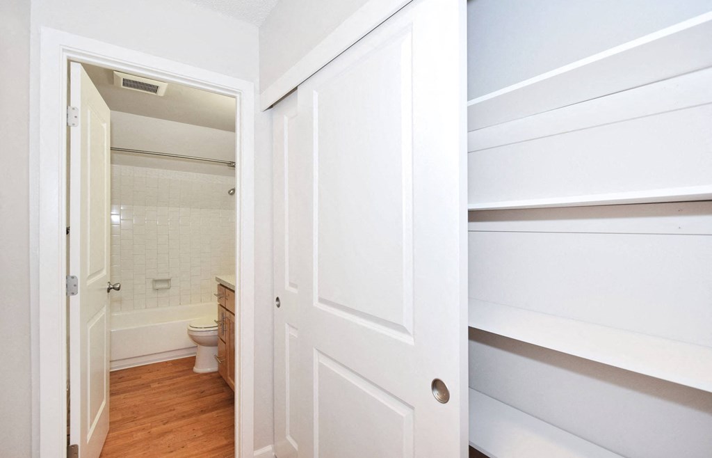 a bathroom with a toilet and a white door
