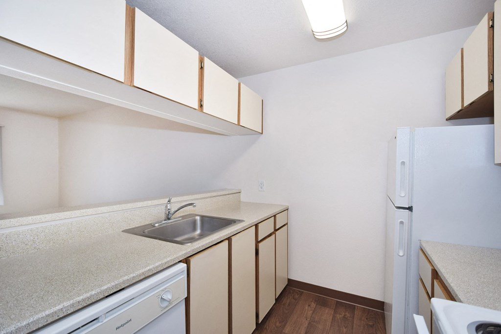 the preserve at ballantyne commons apartment kitchen with sink and refrigerator