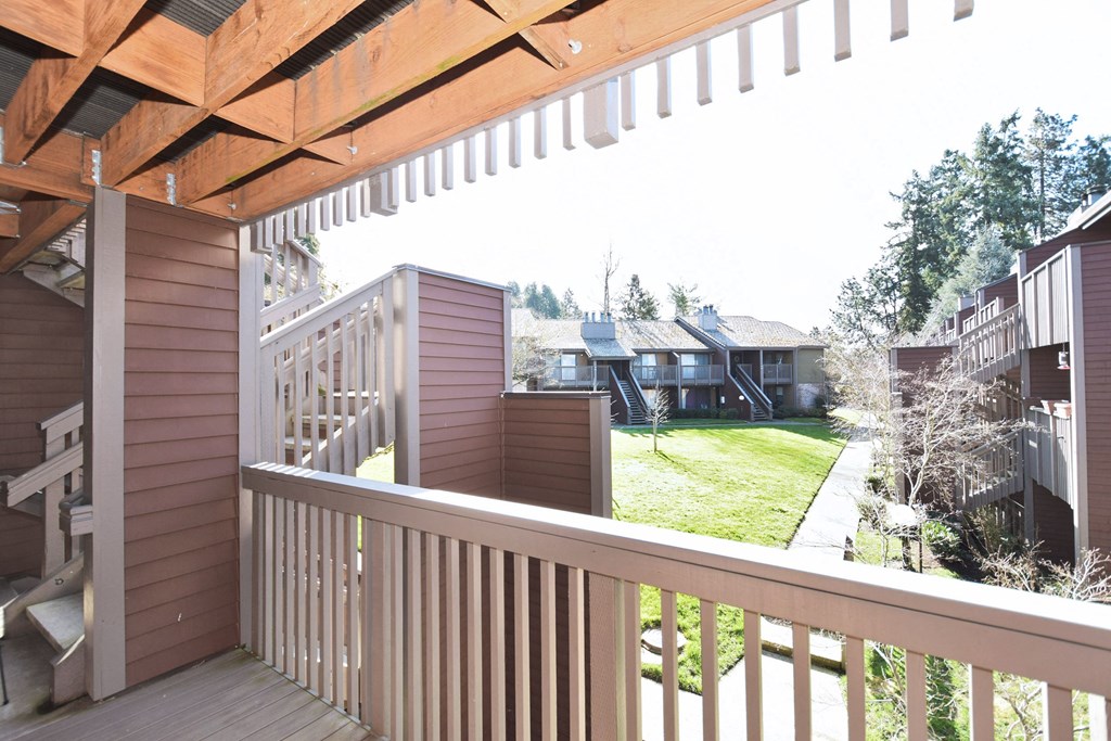 a view of the yard from the deck of a home
