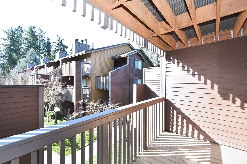 a view of a house from a balcony with stairs