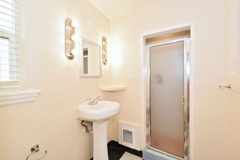 a small bathroom with a sink and a mirror