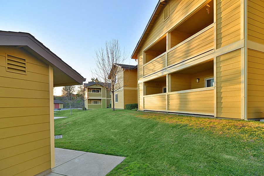 a view of the side of a house with a yard