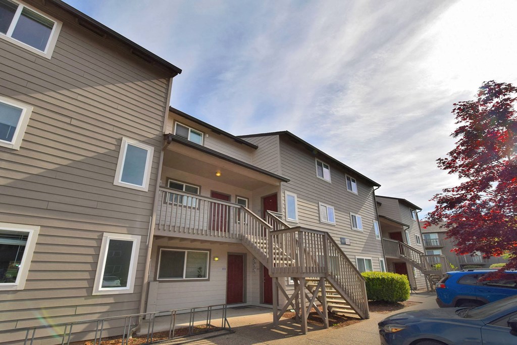 a row of condominiums on a cloudy day