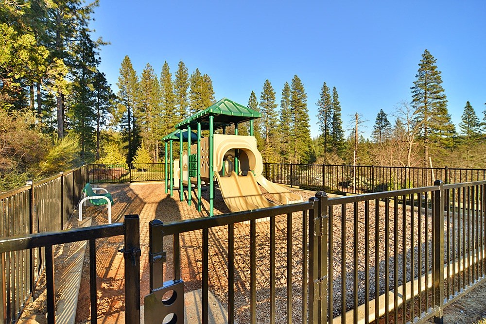 a playground with a slide in a park