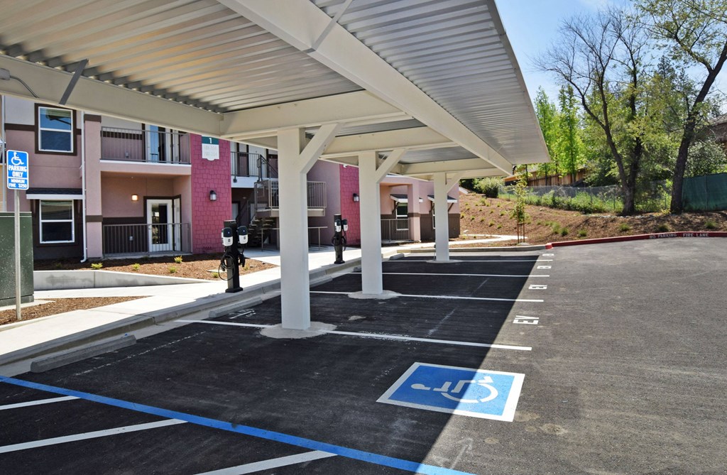 A parking lot with a handicap parking spot.