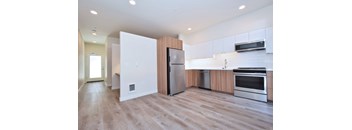 A modern kitchen with wooden accents and stainless steel appliances.
