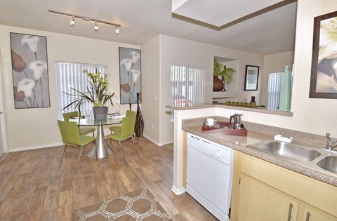 a spacious kitchen and dining room with a table and chairs